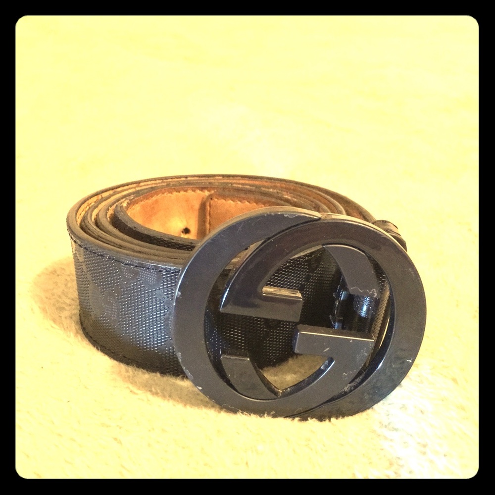 Gucci all black belt with Gucci lettering on belt